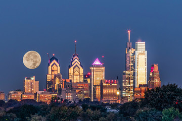Full Moon setting behind Philadelphia 
