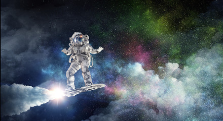 Fototapeta premium Spaceman on flying board. Mixed media