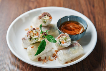 Vietnamese Spring Roll cut in half with sauce