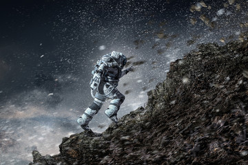 Obraz na płótnie Canvas Spaceman running fast. Mixed media