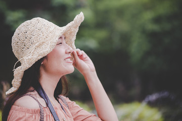 Close up smiling woman traveler with a enjoy photography, travel girl outdoors. Woman are happy with taking photos with a vacation camera.