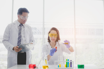 Scientists with test tubes and chemical test or laboratory research.Scientific concepts in...