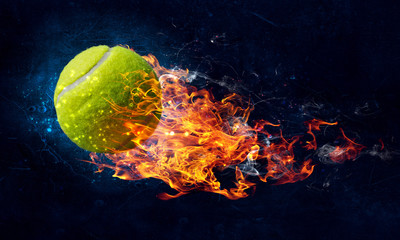 Tennis ball in fire - obrazy, fototapety, plakaty