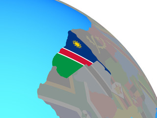 Namibia with national flag on simple blue political globe.
