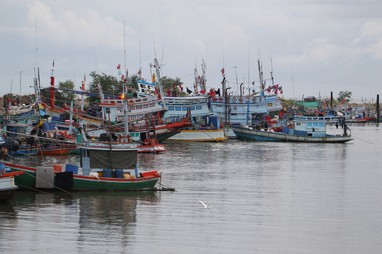 local fisherman boats park to the sea for fishing. Traditional colorful asian fishing boats in fishing village