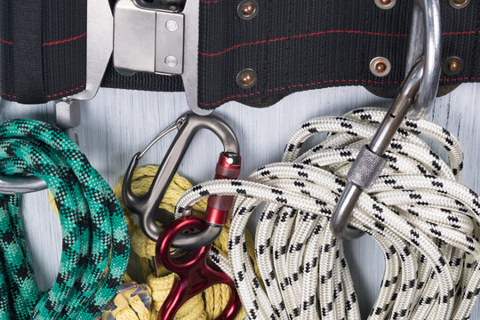 on a belt for a carbine are clinging safety ropes for a rock climber, close-up