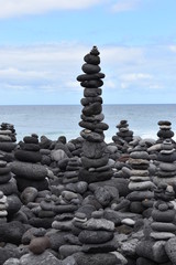 Stacked stone figures on the beach playa jardin in Tenerife in Puerto de la Cruz in Europe