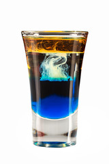 Shot of blue jellyfish layered cocktail isolated at white background.
