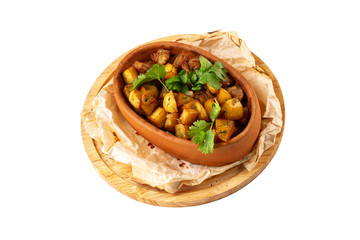 Pot with stew beef and potato served on a cooking paper at wooden board isolated at white background.