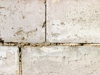 Grey brick wall texture background. Tiled. close- up
