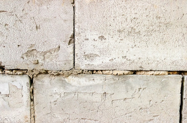 Grey brick wall texture background. Tiled. close- up