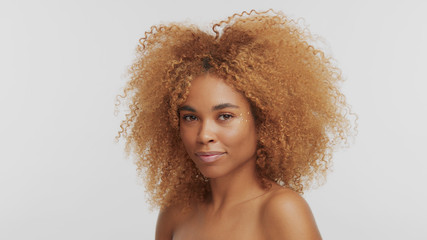 mixed race black blonde model with curly hair