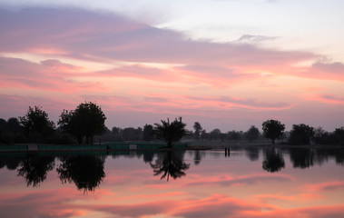 Obraz na płótnie Canvas sun rise at al Qudra nature reserve near Dubai