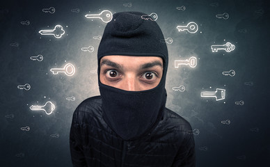 Burglar standing with tools in his hand.