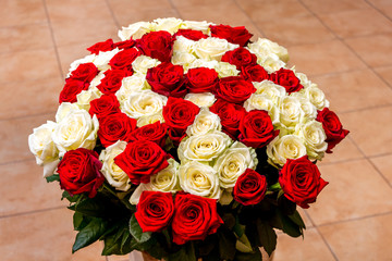 Bouquet of white and red roses for greetings on a holiday_