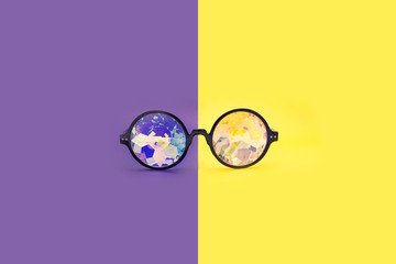 Glasses kaleidoscopes hologram. Points are located frontally on a purple-yellow background