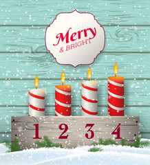 Rustic Christmas advent candlestick with candles in snow