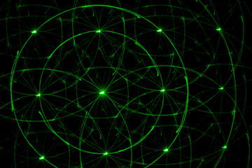 Drawing on a black wall with a green laser. Abstract drawing