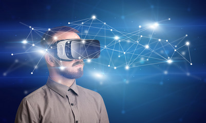 Amazed businessman with virtual reality network concept in front of him