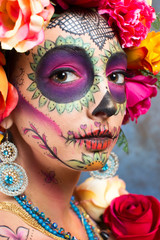 Girl wearing makeup for the dia de los muertos. The day of the dead.