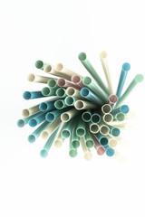 Multicolor and colorful plastic drinking straws on white background. Abstract Background. Multicolor background.