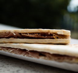 Fritto misto fried fish close up, in brown paper cone; Italian street food