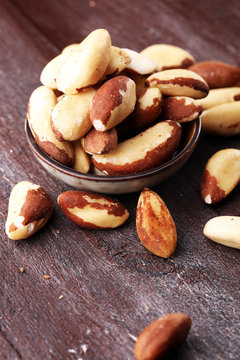 Para nuts on a rustic wooden table and para nuts in bowl