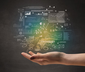Obraz premium Demographic related charts, diagrams and graphs hovering over young hand