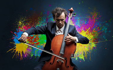 Fototapeta premium Young classical musician with colorful splotch wallpaper 