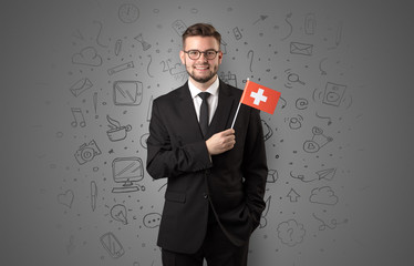 Businessman with office symbol concept and little flag on his hand
