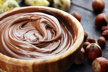 Homemade hazelnut spread in wooden bowl. Hazelnut Nougat cream