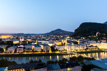 Fototapeta na wymiar Salzburg Cathedral and famous Festung Hohensalzburg illuminated in twilight