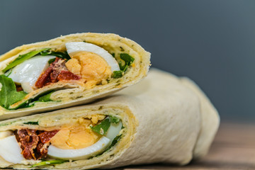 Fresh baguette sandwich on wooden background. Classic BLT sandwiches. Close up.