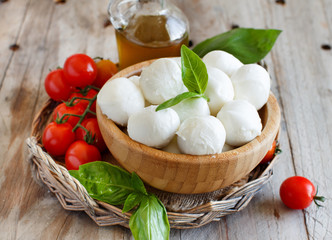 Italian cheese mozzarella with tomatoes, basil and olive oil © katrinshine