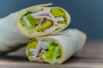 Fresh baguette sandwich on wooden background. Classic BLT sandwiches. Close up.