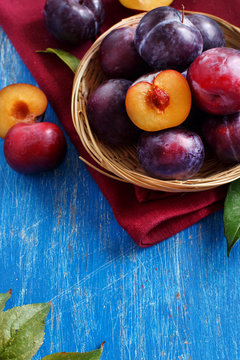 Fresh plums with leaves