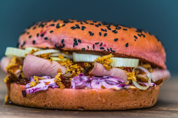Fresh baguette sandwich on wooden background. Classic BLT sandwiches. Close up.