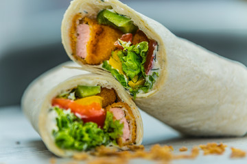 Fresh baguette sandwich on wooden background. Classic BLT sandwiches. Close up.