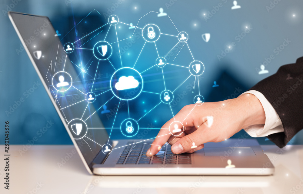 Poster Hand using laptop with centralized cloud computing system and network security concept
