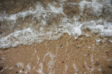Soft wave of the sea on the sandy beach