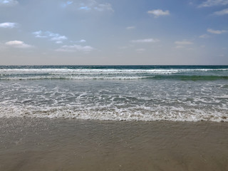 Fototapeta na wymiar Sand and waves