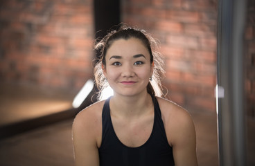 Young pretty woman in sport clothes. Smiling