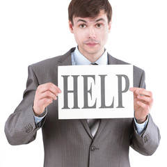 young businessman showing a sheet that says HELP