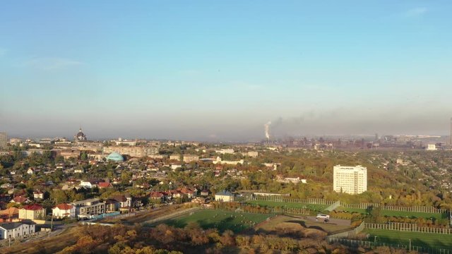 Metallurgical plant in the city. Environmental pollution. Aerial video