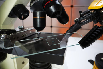 Microscope slide in robot arm and science microscope