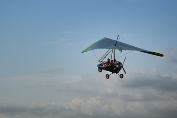 people fly on a trike