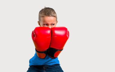 Little kid with boxing gloves