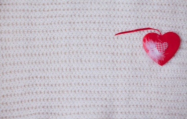 St. Valentines Day concept with hearts and warm knitted scarf with copy space