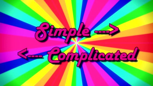 The text Simple, Complicated, with arrows pointing in opposing directions, fancy font, appearing on a rainbow pinwheel colorful animation, moving rays of different colors. 1980s retro vintage intro.