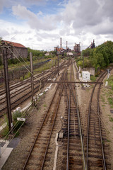 Obraz premium Railway lines to a Coke factory